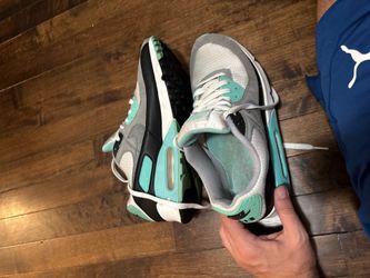 Nike Air Max 90 sneakers in a clean gray/mint colorway.