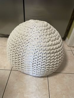 White crocheted covered beanbag pillow