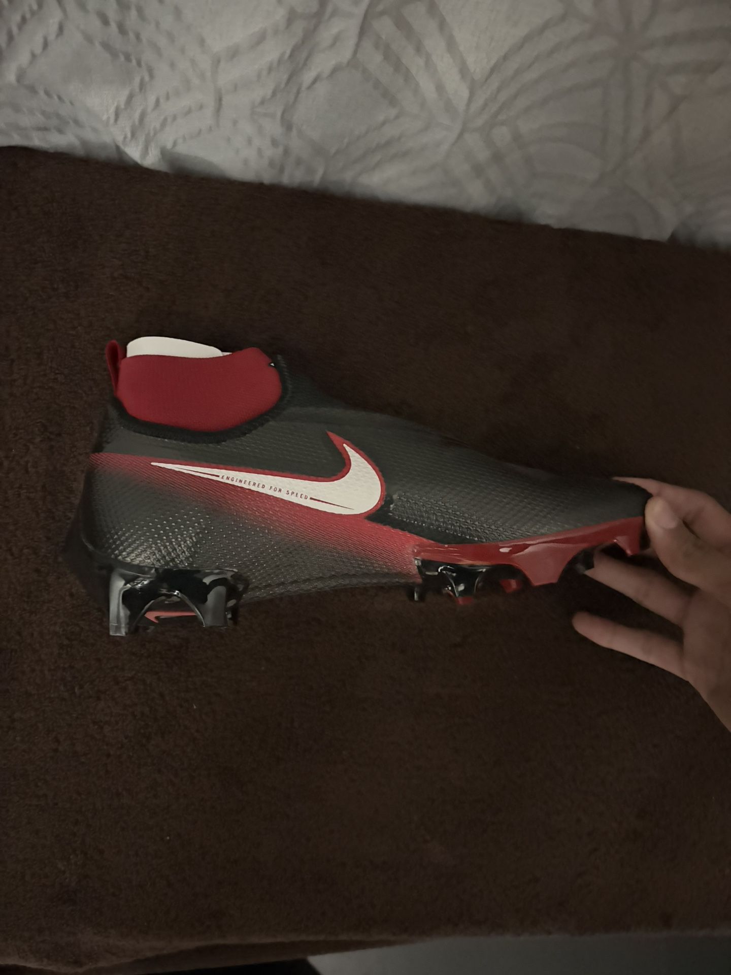 BLACK AND RED NIKE FOOTBALL CLEATS