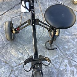 TWO GREAT 3–WHEEL GOLF PUSH CARTS.   ONE EVEN HAS A SEAT TO SET ON. NO MORE CARRING YOUR GOLF BAG. 