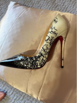 Black and white Louboutin pumps