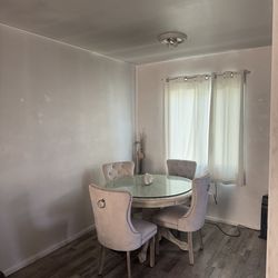 Round table with 4 chairs included.