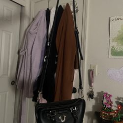 True Religion women's black satchel bag with a crossbody strap