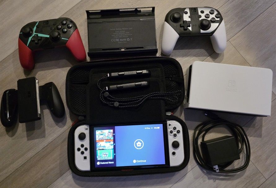 Nintendo Switch OLED Model HEG 001 – 64GB Console + 512 SD + 2 Pro Controllers