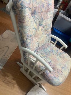 Solid Wood ! Absolutely beautiful ! Cushion is unbelievable comfy!