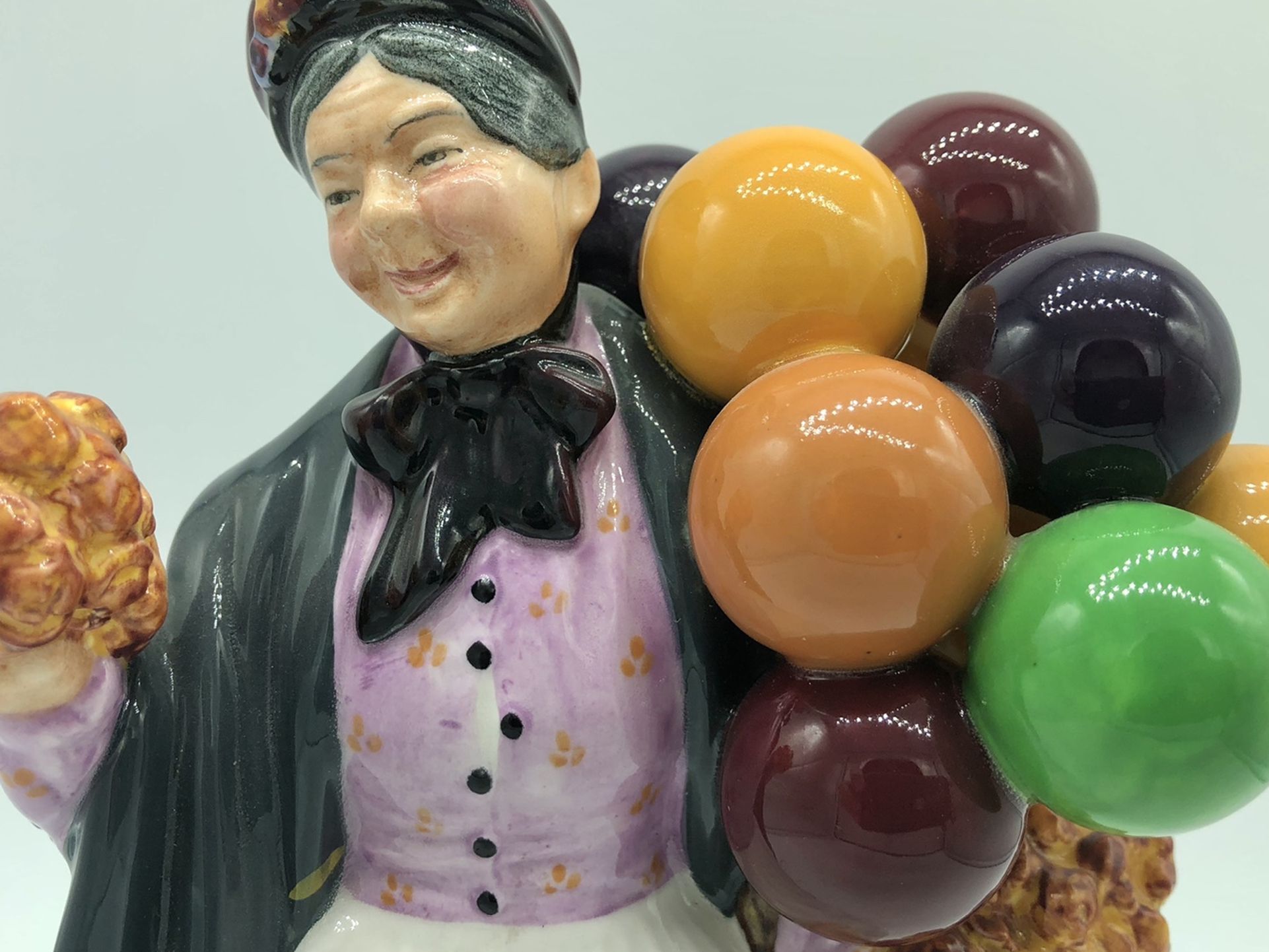 Royal Doulton NH 1843 “Biddy Penny Farthing” Figurine