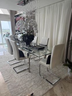 Glass dining table expendable with 6 leather chairs