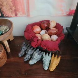 Carved Dragons Heads And Polished Eggs