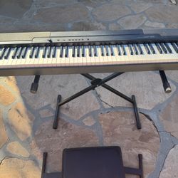 Piano with seat and stand