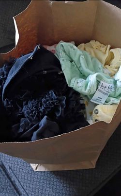 Bag full of baby girl clothes sizes 0 to 3 months and 3 to 6 months