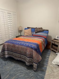 Boho Striped Quilt Bedding Set and full mattress with box spring on rollers