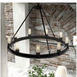 Brand new, still in box, black 9-light chandelier with a circular metal frame and clear light bulbs. Includes original packaging.
