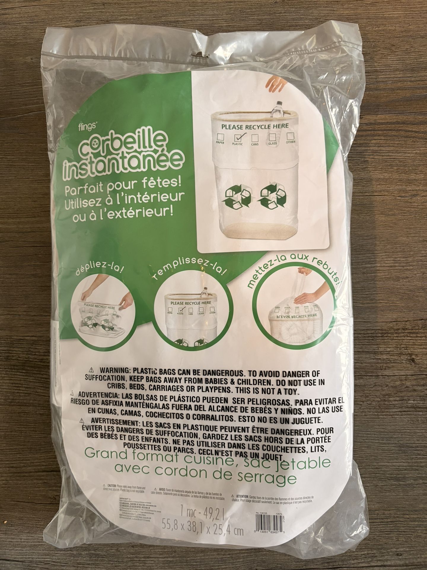 Pop-Up Trash Bin, which is a disposable, tall kitchen-sized bag with a drawstring closure. It is designed for use at parties 