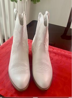 Woman’s Cowboy Boot And Hat