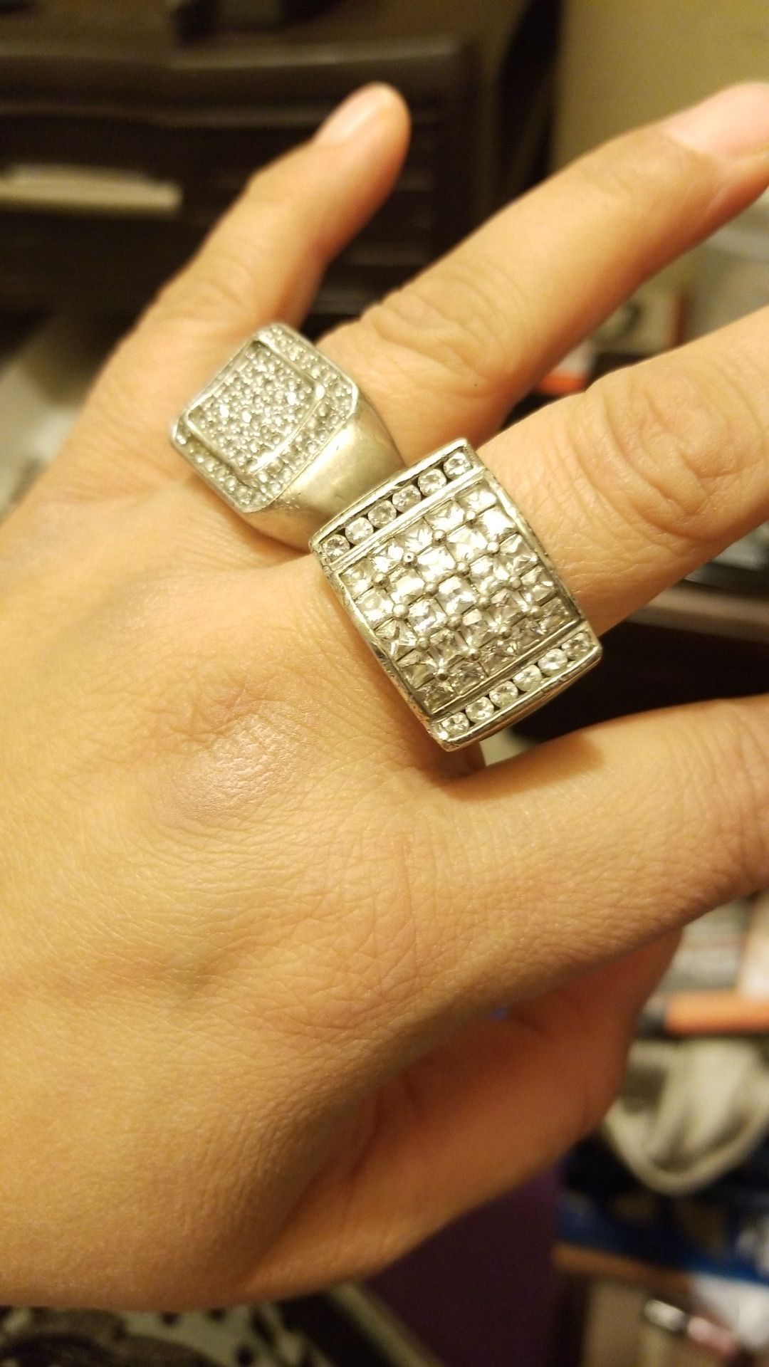 MENS 2 RING COMBO 1 IS STERLING AND 1 METAL IS UNKNOWN