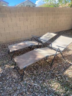 Two pool lounge chairs