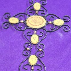 Pavilion Gift Company "Trust in The Lord" wall hanging cross, which features decorative metal scrollwork and inspirational text. J1Q010