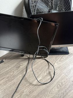 two monitors and computer