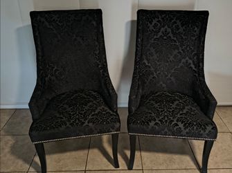2 very nice black upholstery chairs