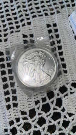 Ounce of silver dollar coin