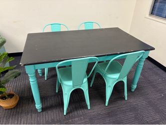 Black and teal table with four chairs