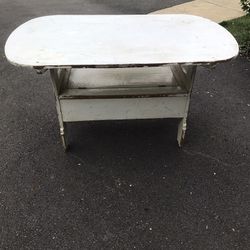Antique rustic wooden tilt-top table with storage compartment. 
