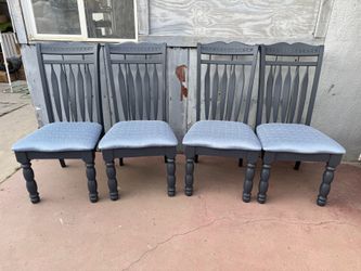 Four regular chairs solid wood in good condition all chairs have new paint and new upholstery on it