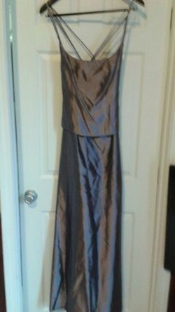 Size 12 full length gown. Purplish color. Beautiful crisscross straps in back. Worn once