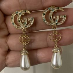 Gu Cci.   Earrings 