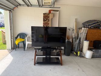 55” TV with stand included $125.00 OBO