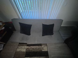 futon sofa with pillows