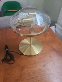 A table top gold 1921 lamp