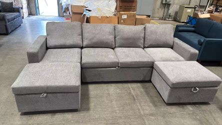 Light gray sectional sofa with ottoman and pullout bed