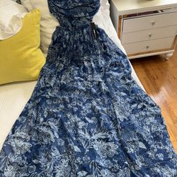 Fashion Nova Strapless   Maxi dress Size Medium , Elastic at the waist and back. And the skirt part has two openings in the front, new with tags.