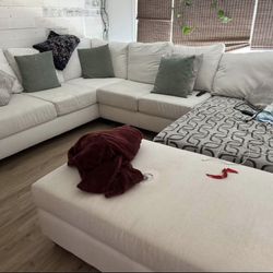 Custom cream/off white performance fabric sectional couch with extra large ottoman 