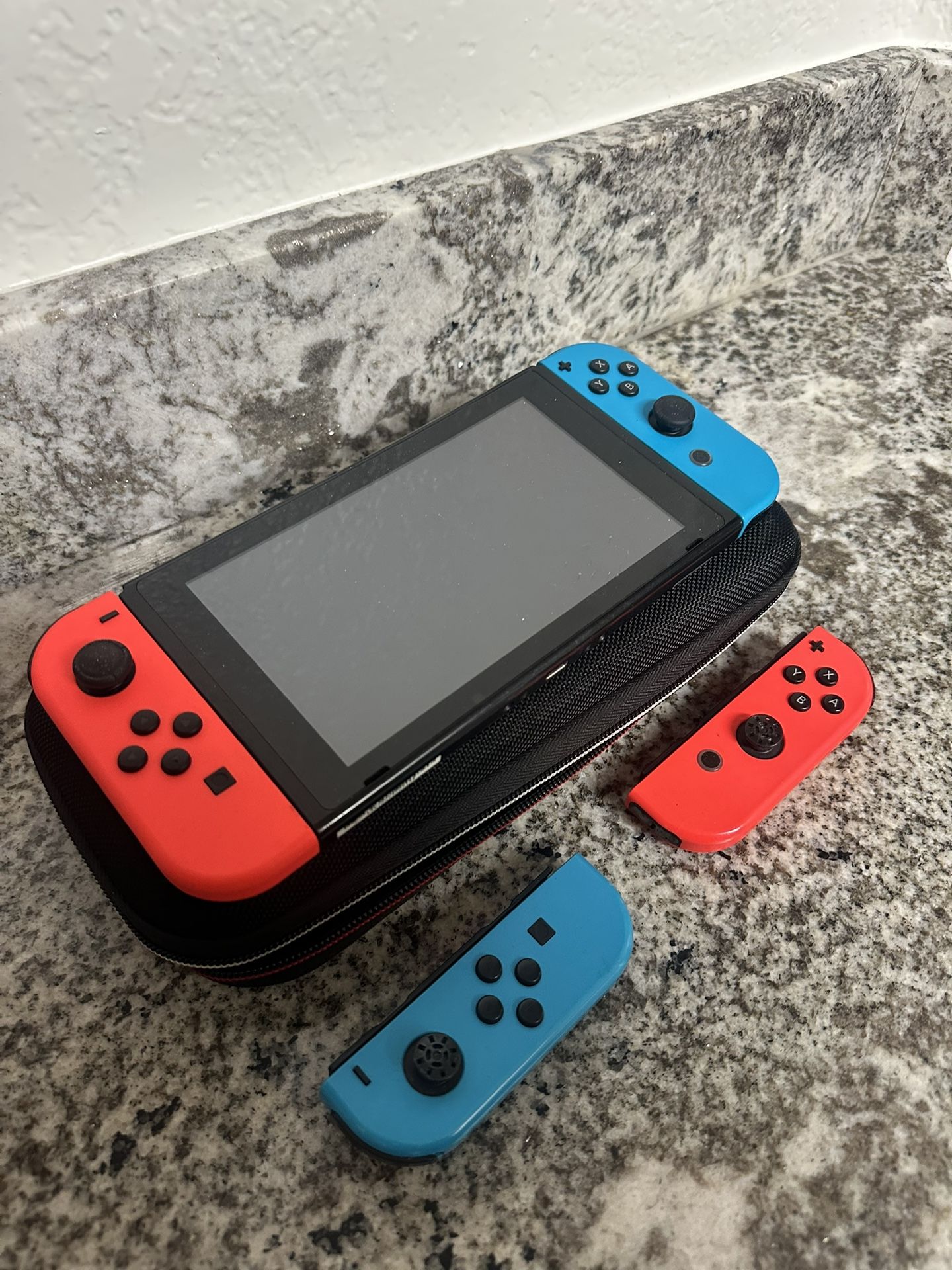 Nintendo Switch + 2 Sets of Joy Cons