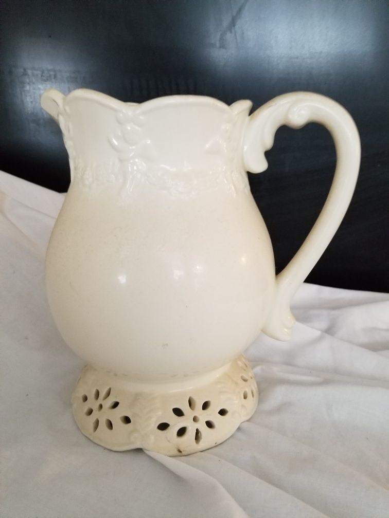 Vintage white pitcher with cherubs 9" tall