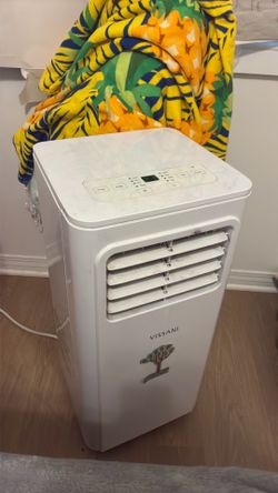 Vissani Portable AC - Rolls, attaches to window, works well