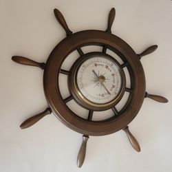 Vintage  Rare Large Ship Wheel Nautical Barometer West Germany Wood Wall 
Mount. Diameter of barometer itself approximately 11.25. With wood 
spokes i