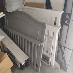 two complete baby cribs ..white and grey different style headboards 