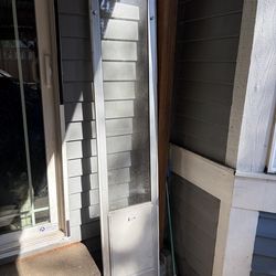 Back door slider dog door insert.