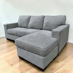 Light Gray Modern Greaves 85” Sectional Sofa with Reversible Chaise by Ashley HomeStores