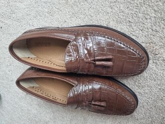 Florsheim Men's Pisa Moc Toe Tassel Loafer in cognac crocodile print leather.
