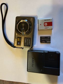 Compact Sony Cyber-shot DSC-W300 digital camera with a titanium coating. This 13.6 megapixel camera has a Carl Zeiss Vario-Tessar lens and a 2.7-inch 