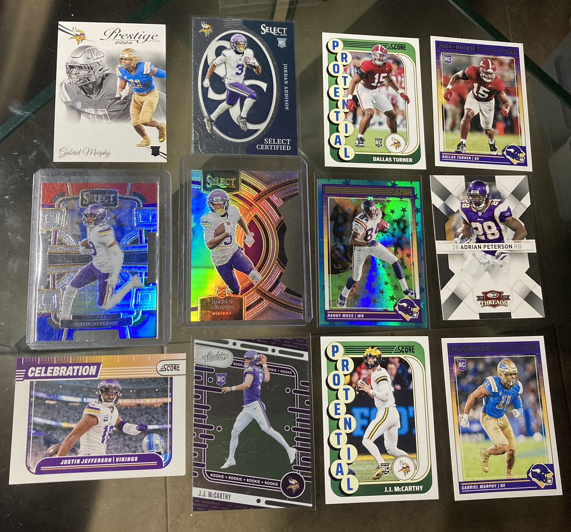 12 2024 football card lot Vikings J.J. McCarthy Rc absolute , Jordan Addison die cut holo Rc , Justin Jefferson die cut holo ,Randy Moss stars holo /3
