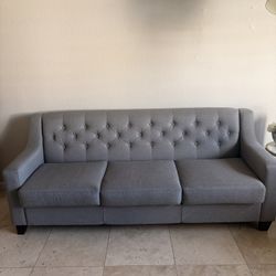 MID-CENTURY MODERN YELLOW ACCENT CHAIR AND MODERN GRAY TUFTED COUCH