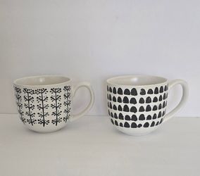 ☕️SET of 2~The Old Pottery Company coffee mugs featuring distinct black and white patterns on a white base.
☕️BOTH for $14 firm. 
✨️EXCELLENT PRE-OWNE