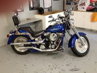 1996 softail motorcycle and Trailer ( Diamond plated deck and LED lights all around ).
