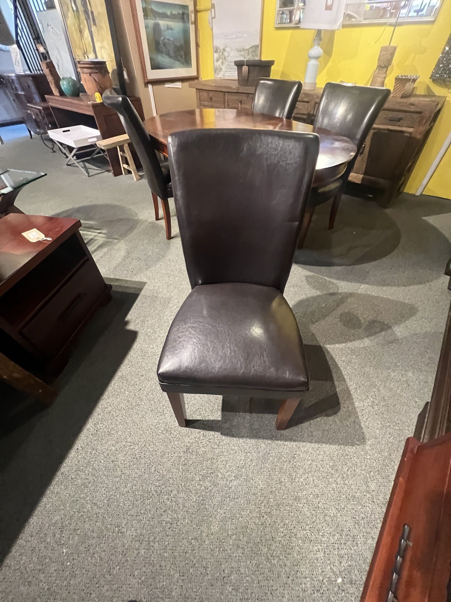 DINING CHAIRS: Set of 4 dark brown vinyl Dining Chairs w/ wooden legs SKU 1H1Z12