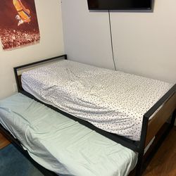 Child’s Twin bed with trundle and Mattresses 